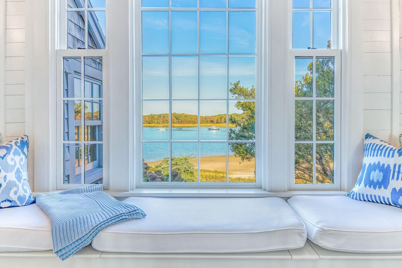 75 Winsor Road Cataumet, MA 02534 - Photo 15 of 27 a bedroom with a bed and glass window