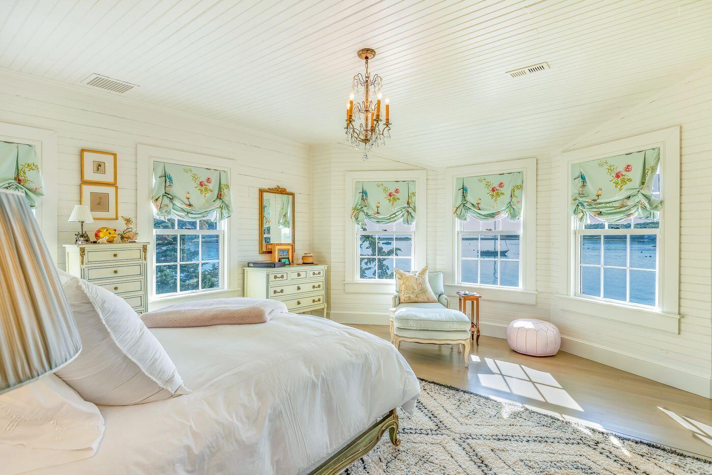 75 Winsor Road Cataumet, MA 02534 - Photo 16 of 27 a bedroom with a large bed and a large window