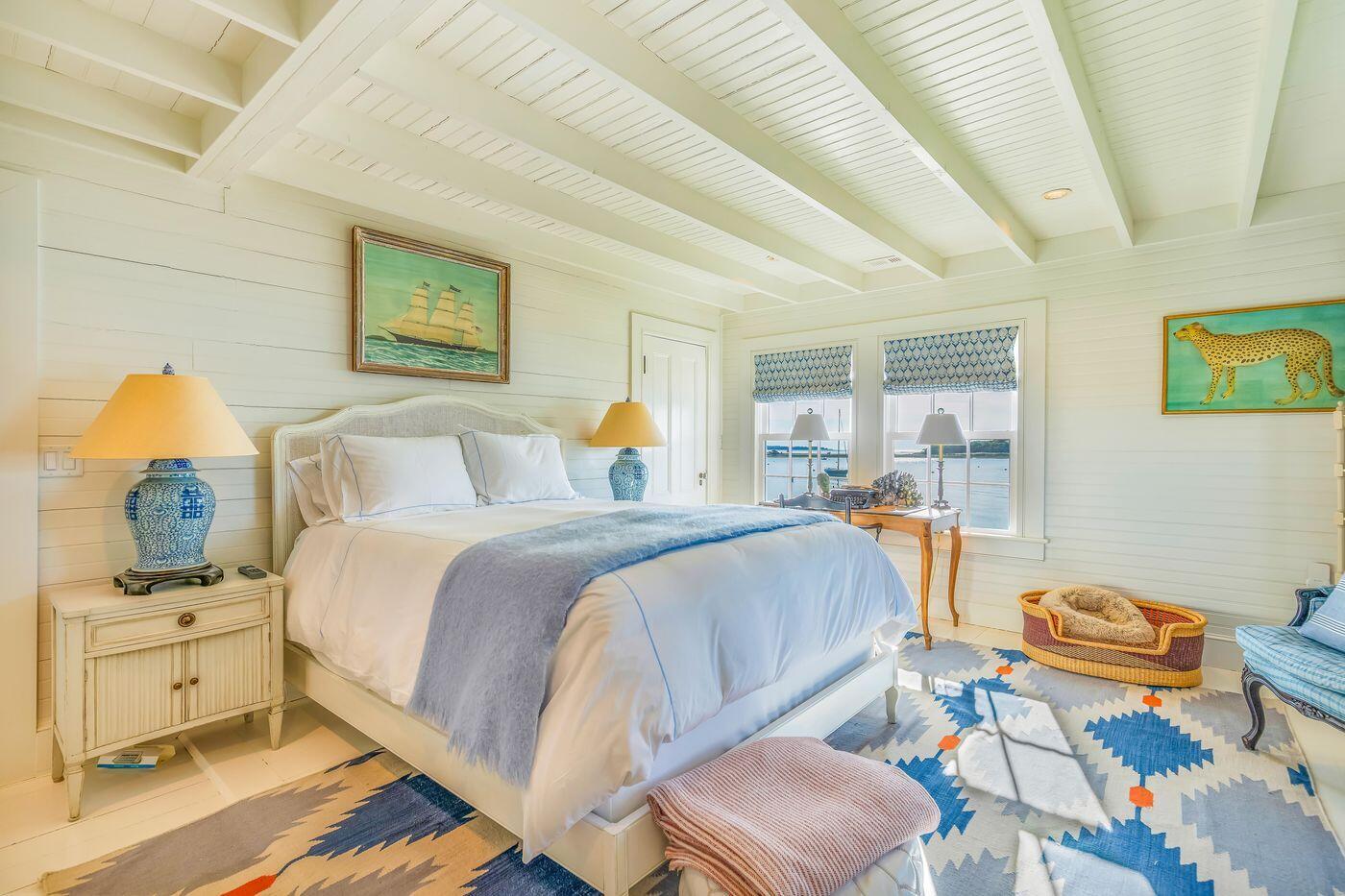 75 Winsor Road Cataumet, MA 02534 - Photo 19 of 27 a bedroom with a bed and wooden floor