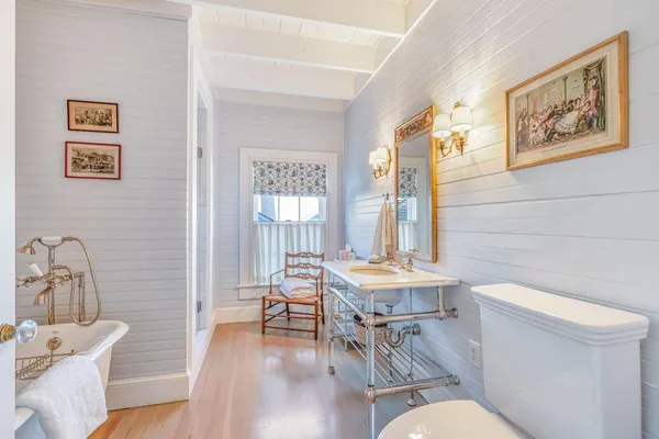 a view of a house with swimming pool next to a yard