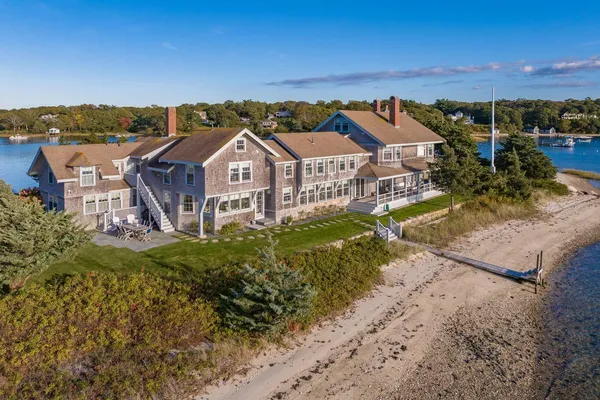 an aerial view of a house with a yard