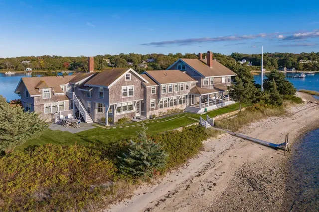 an aerial view of a house with a yard