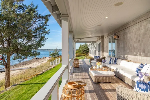 a balcony with furniture and garden view