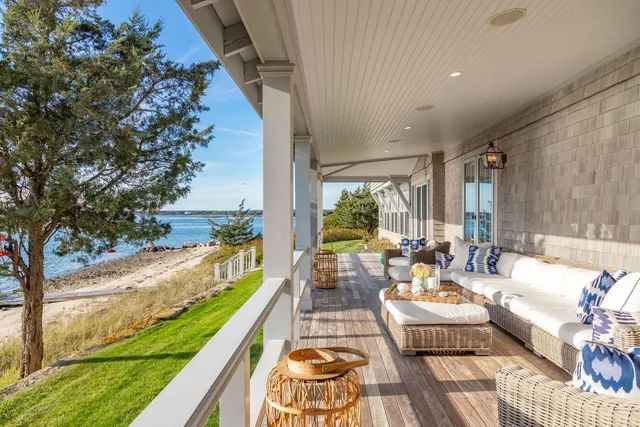 a balcony with furniture and garden view