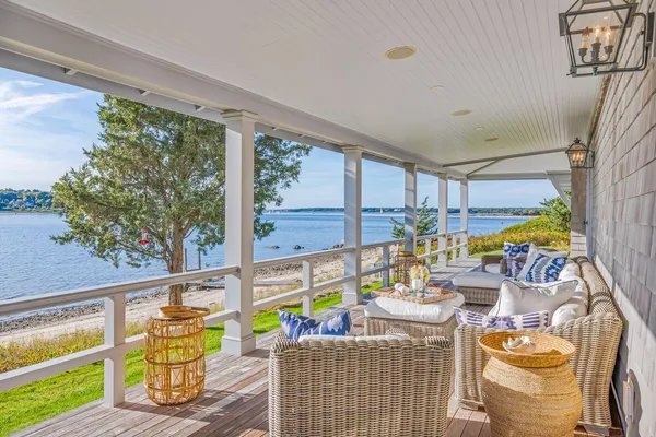 a living room with furniture and stairs