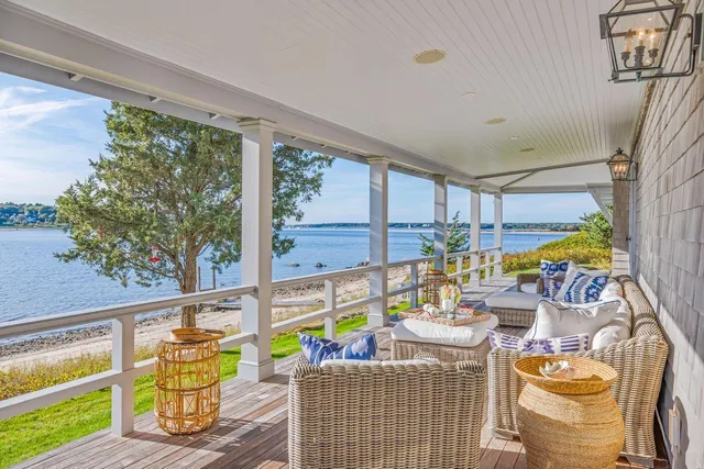 a living room with furniture and stairs