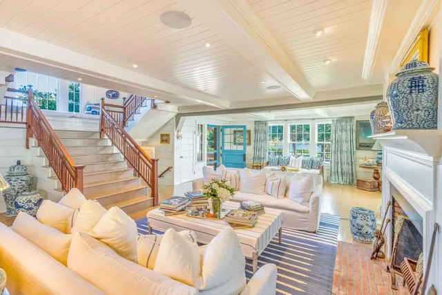 a living room with furniture and a table