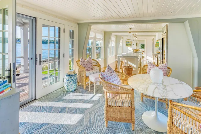 a view of a living room and kitchen with a large window