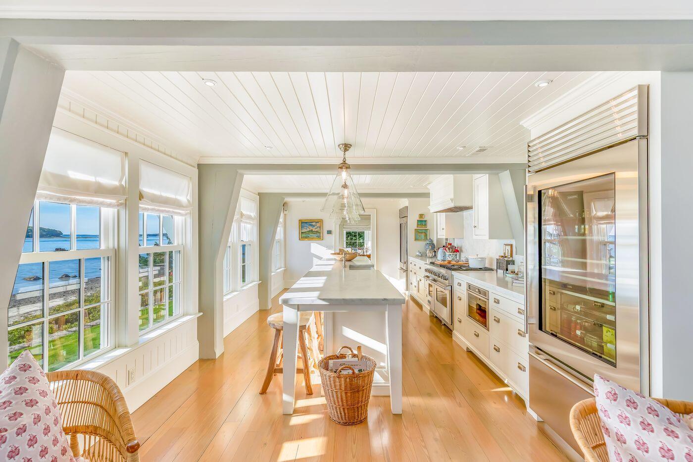 75 Winsor Road Cataumet, MA 02534 - Photo 10 of 27 a view of a living room and kitchen with a large window