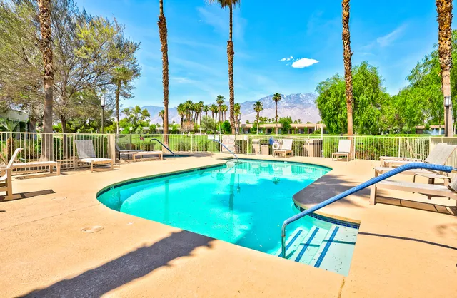 a view of a swimming pool with a patio