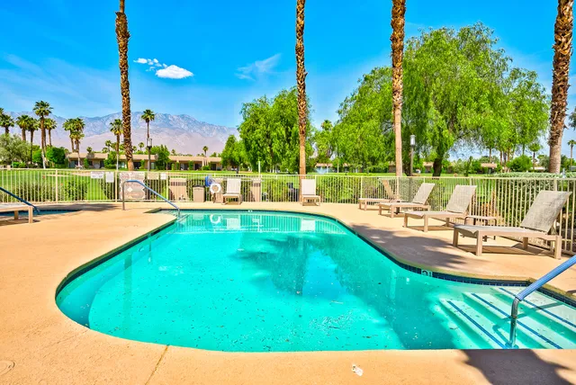 a view of a swimming pool with a patio