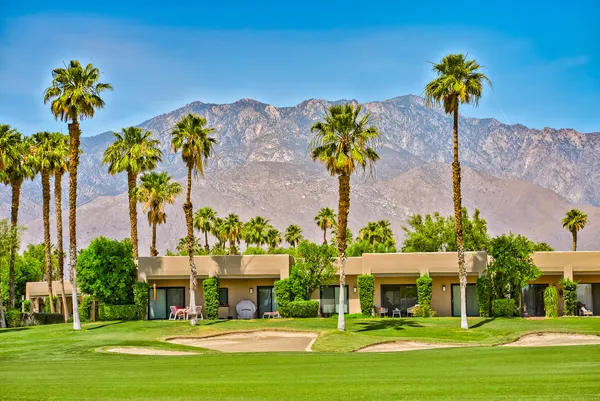 a front view of a building with garden
