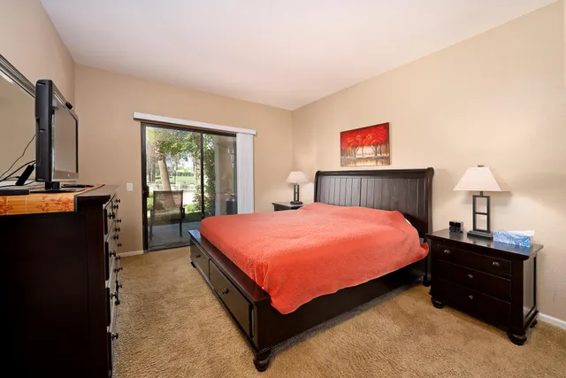 a bedroom with a bed and a dresser