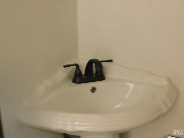 a living room with furniture a window and a flat screen tv