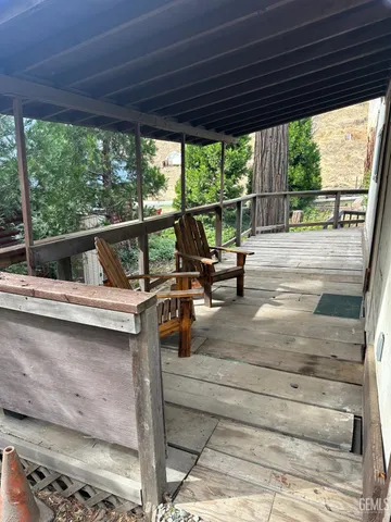 a view of living room with balcony and furniture