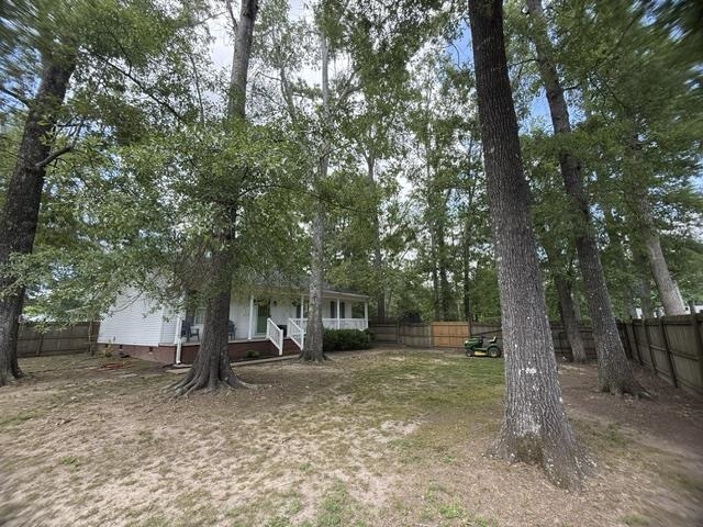 395 Austin Street Savannah, TN 38372 - Photo 25 of 32 Spacious rear yard with mature trees and a privacy fence