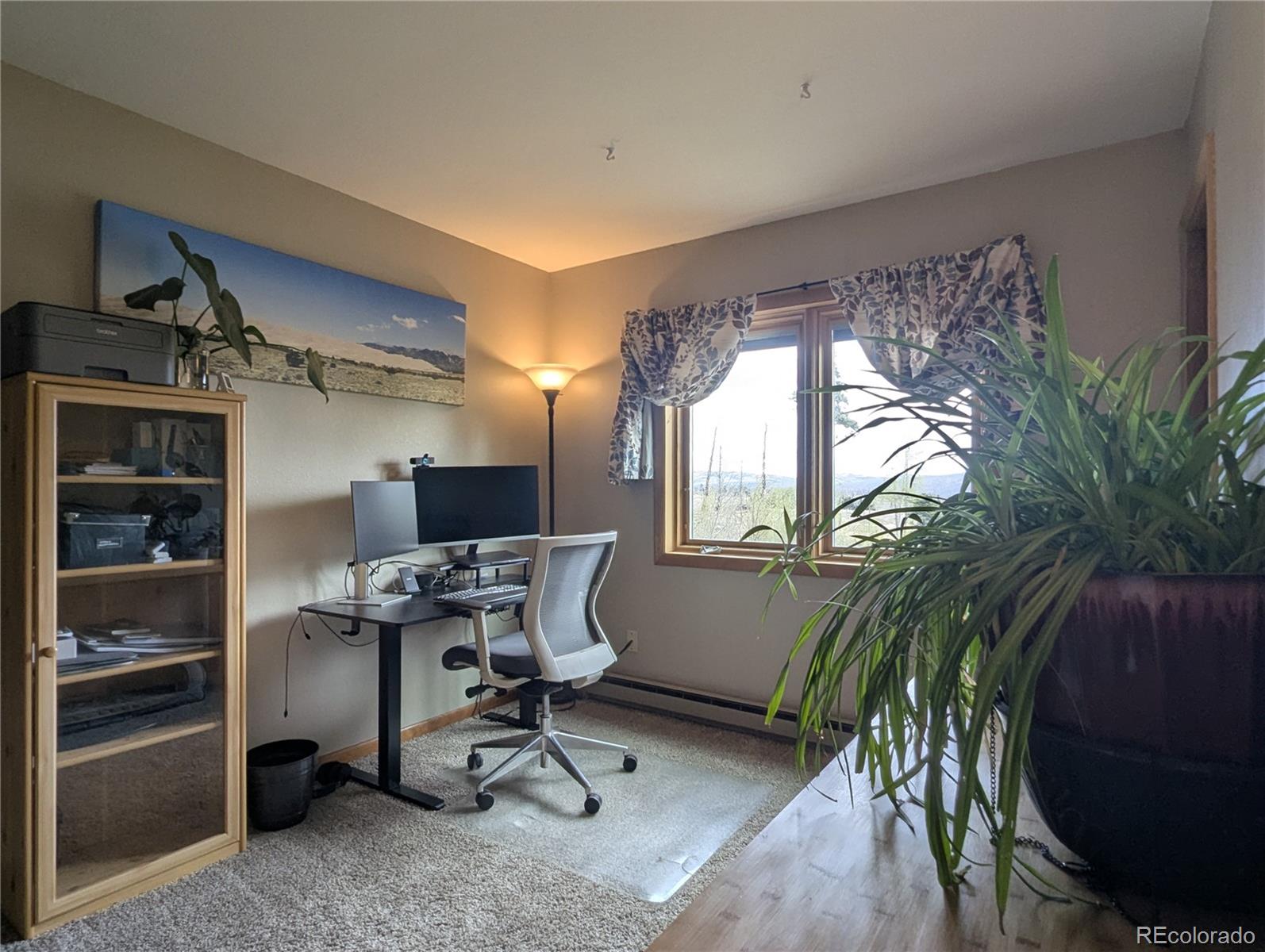 2084 Forbes Park Road Fort Garland, CO 81133 - Photo 33 of 39 a view of a workspace with furniture and a potted plant