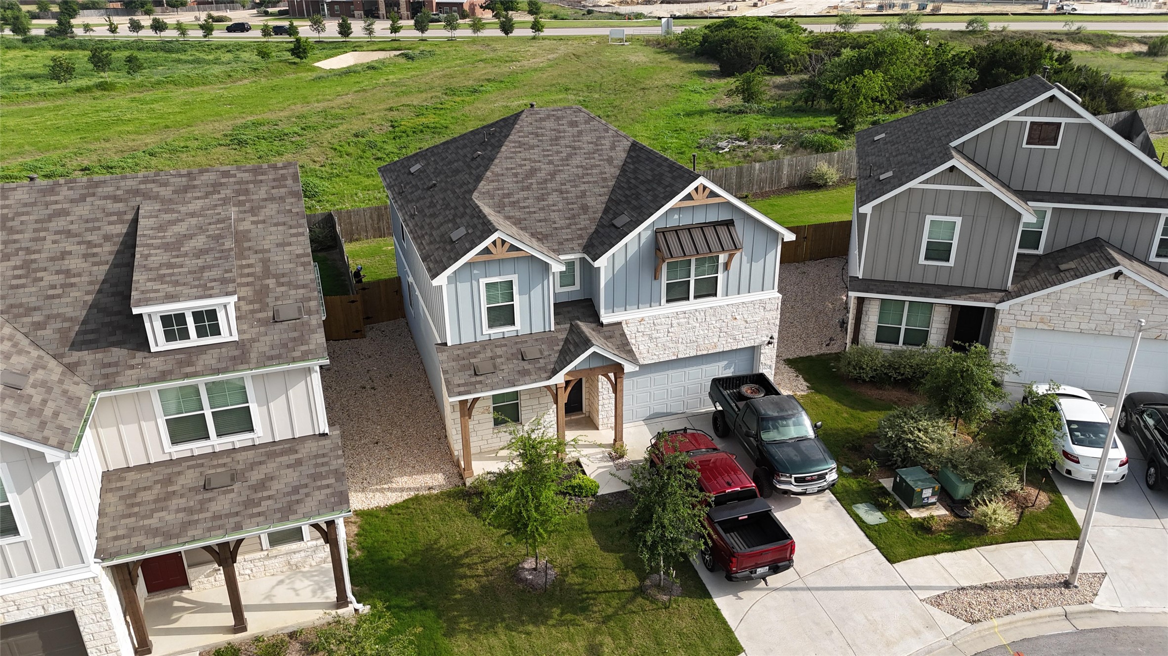 620 Acuff Lane Leander, TX 78641 - Photo 12 of 14 Modern two-story residence featuring light blue siding and stone veneer accents
