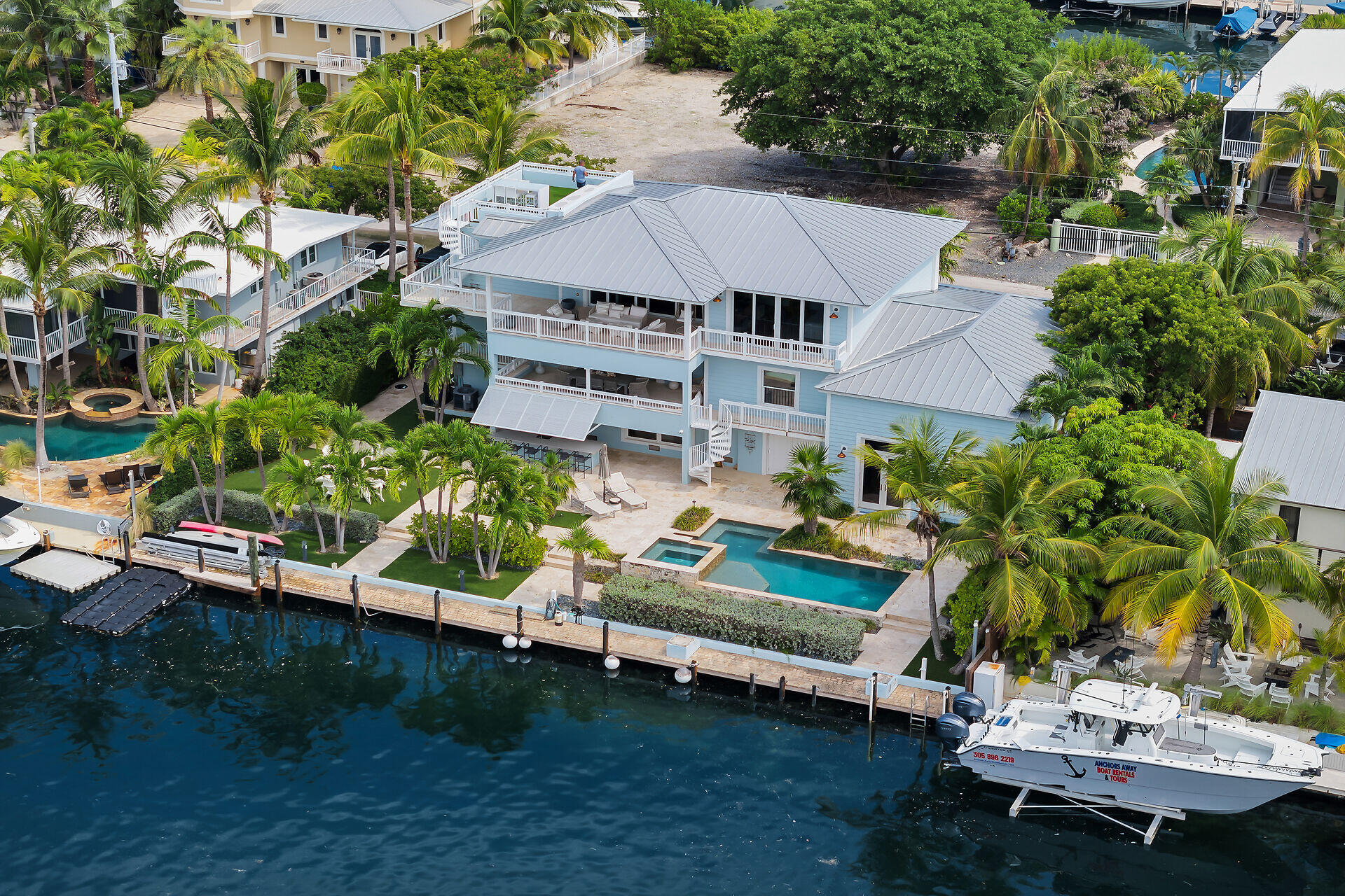 133 Severino Drive Islamorada, FL 33036 - Photo 3 of 27 a view of a house with a yard and sitting area