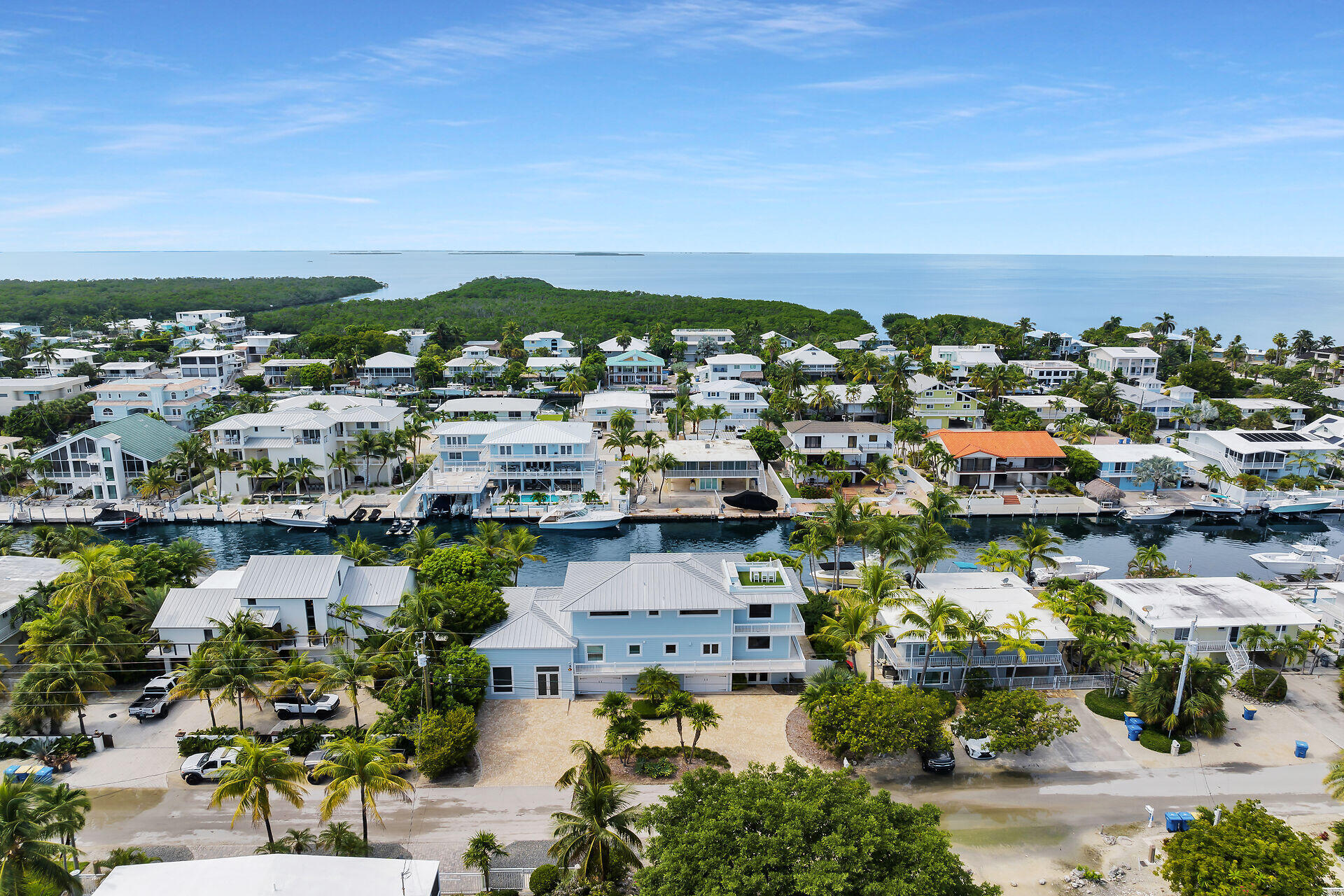 133 Severino Drive Islamorada, FL 33036 - Photo 6 of 27 an aerial view of a city with lots of residential buildings and ocean view in back