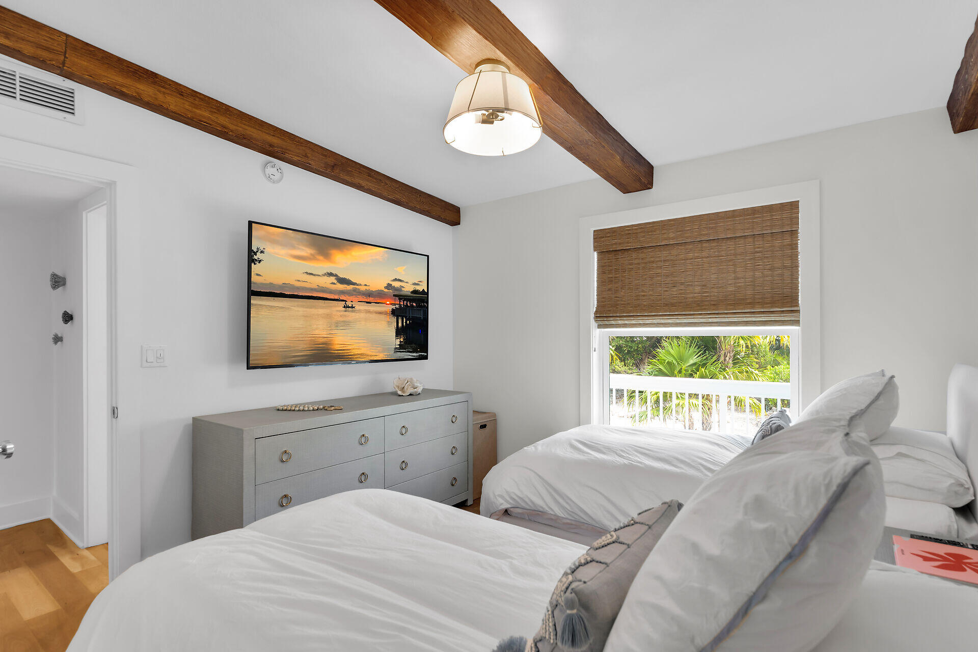 133 Severino Drive Islamorada, FL 33036 - Photo 10 of 27 a bedroom with a bed and a flat screen tv