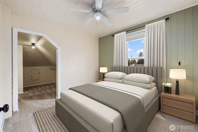 a bedroom with a large bed and a chandelier