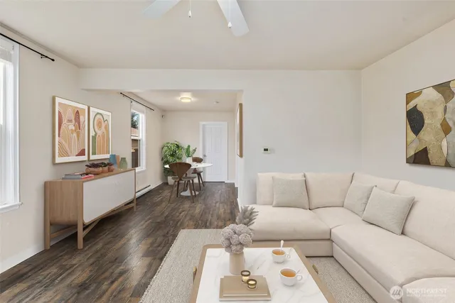 a living room with furniture and a wooden floor