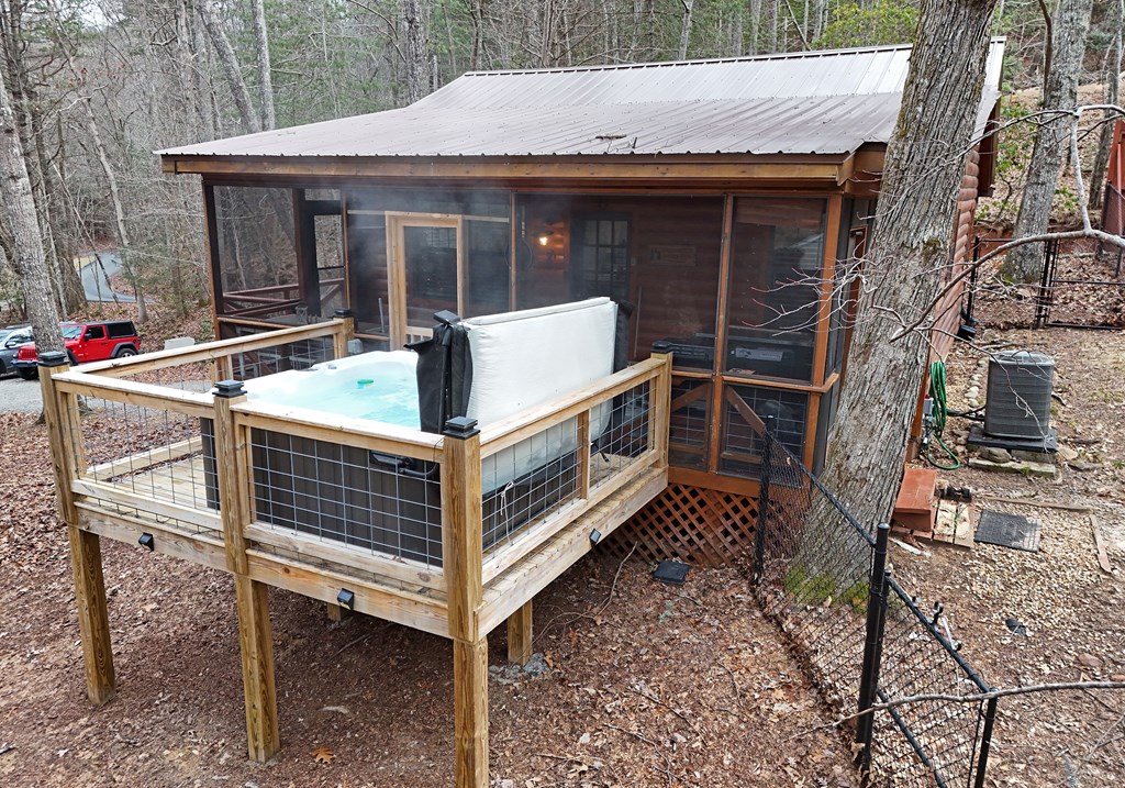 266 Mabry Lane Morganton, GA 30560 - Photo 3 of 37 a view of a house with backyard and deck