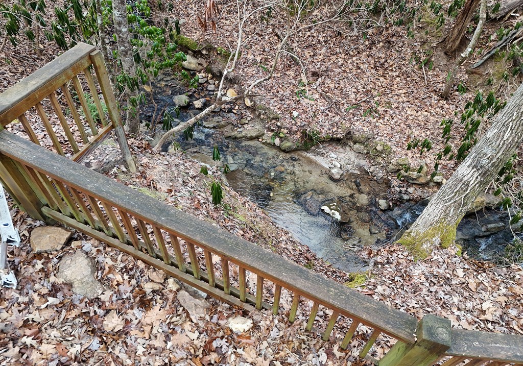 266 Mabry Lane Morganton, GA 30560 - Photo 8 of 37 a picture of a tree with a wooden fence