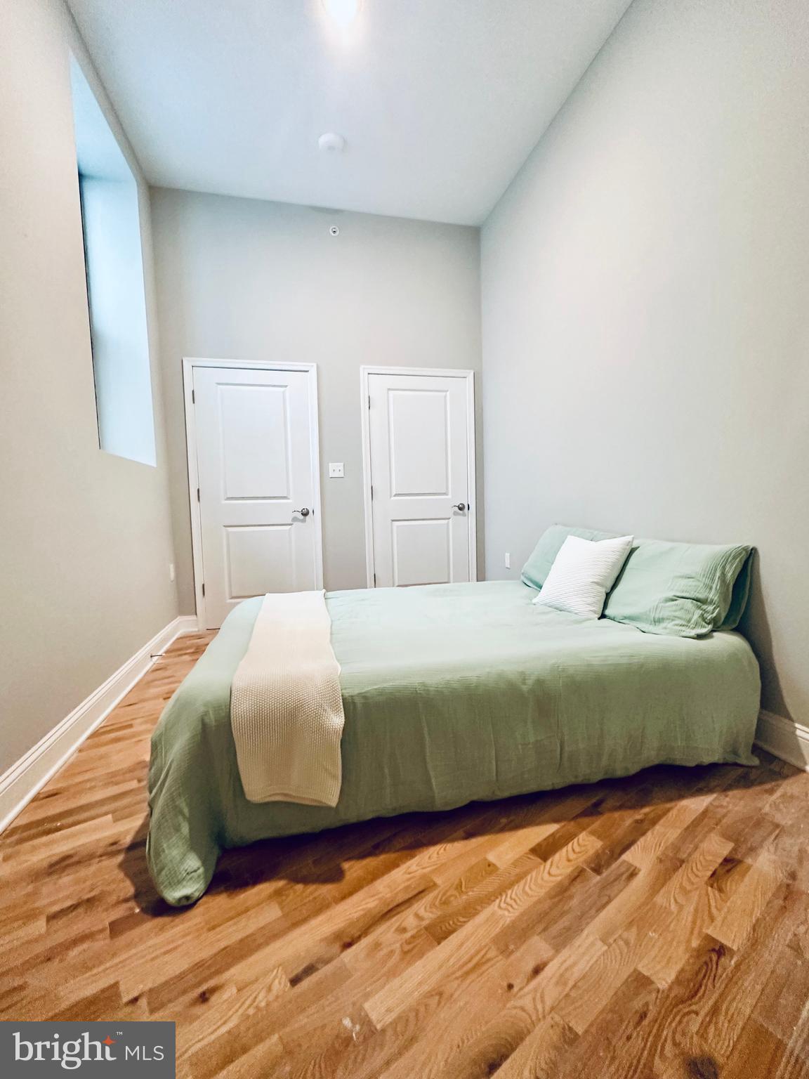 100 West Lexington Street, Unit 305 Baltimore, MD 21201 - Photo 16 of 38 a bedroom with a bed and window