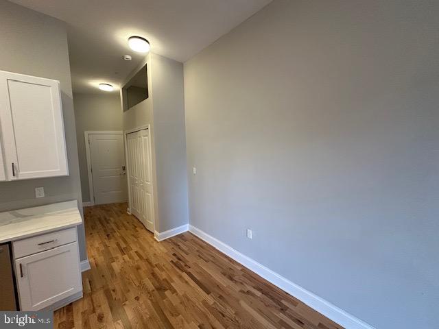 100 West Lexington Street, Unit 305 Baltimore, MD 21201 - Photo 30 of 38 a view of empty room with wooden floor