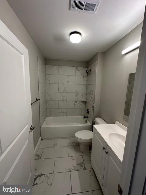 100 West Lexington Street, Unit 305 Baltimore, MD 21201 - Photo 34 of 38 a bathroom with a sink a toilet and shower