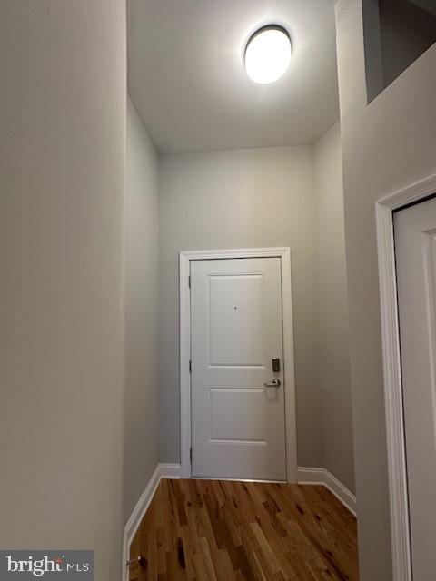 100 West Lexington Street, Unit 305 Baltimore, MD 21201 - Photo 38 of 38 a bedroom with a bed and a mirror