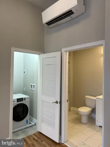 a bathroom with a toilet and a sink