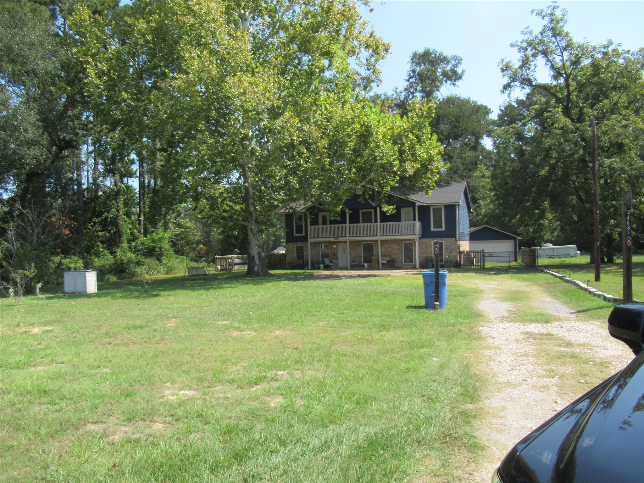 24685 Sorters Road Porter, TX 77365 - Photo 3 of 6 a view of a house with a backyard