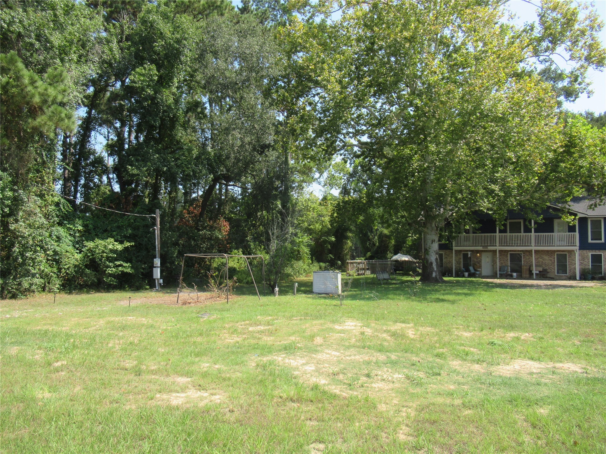 24685 Sorters Road Porter, TX 77365 - Photo 5 of 6 a swimming pool with outdoor seating and yard