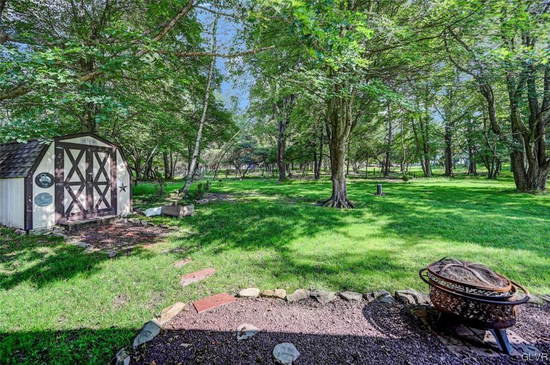 118 Shortridge Road Albrightsville, PA 18210 - Photo 27 of 28 View of the tree-lined back yard & firepit area (L