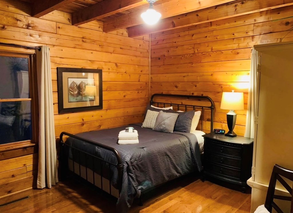 22 Waterloon Trail Morganton, GA 30560 - Photo 12 of 71 a bedroom with a bed and wooden floor