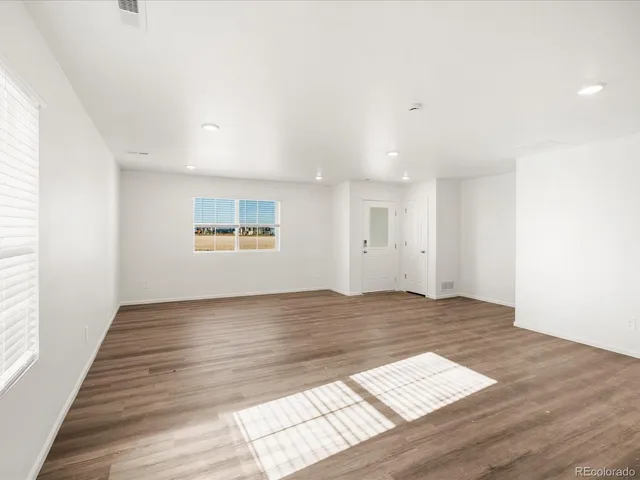 a view of an empty room and window