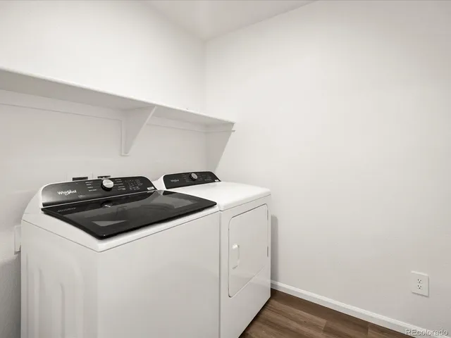a white stove top oven sitting inside of a kitchen