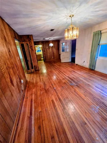 a view of an entryway with wooden floors
