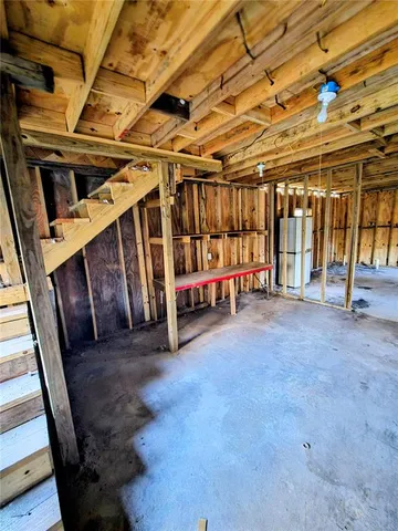 a view of an empty room with wooden walls