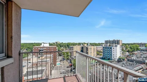 a view of a balcony with city view