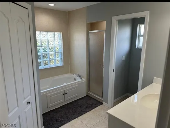 a bathroom with a tub and a sink