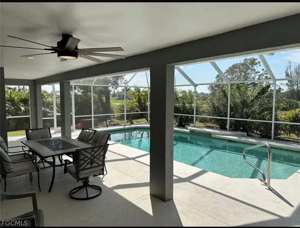 a view of a porch with furniture and a yard