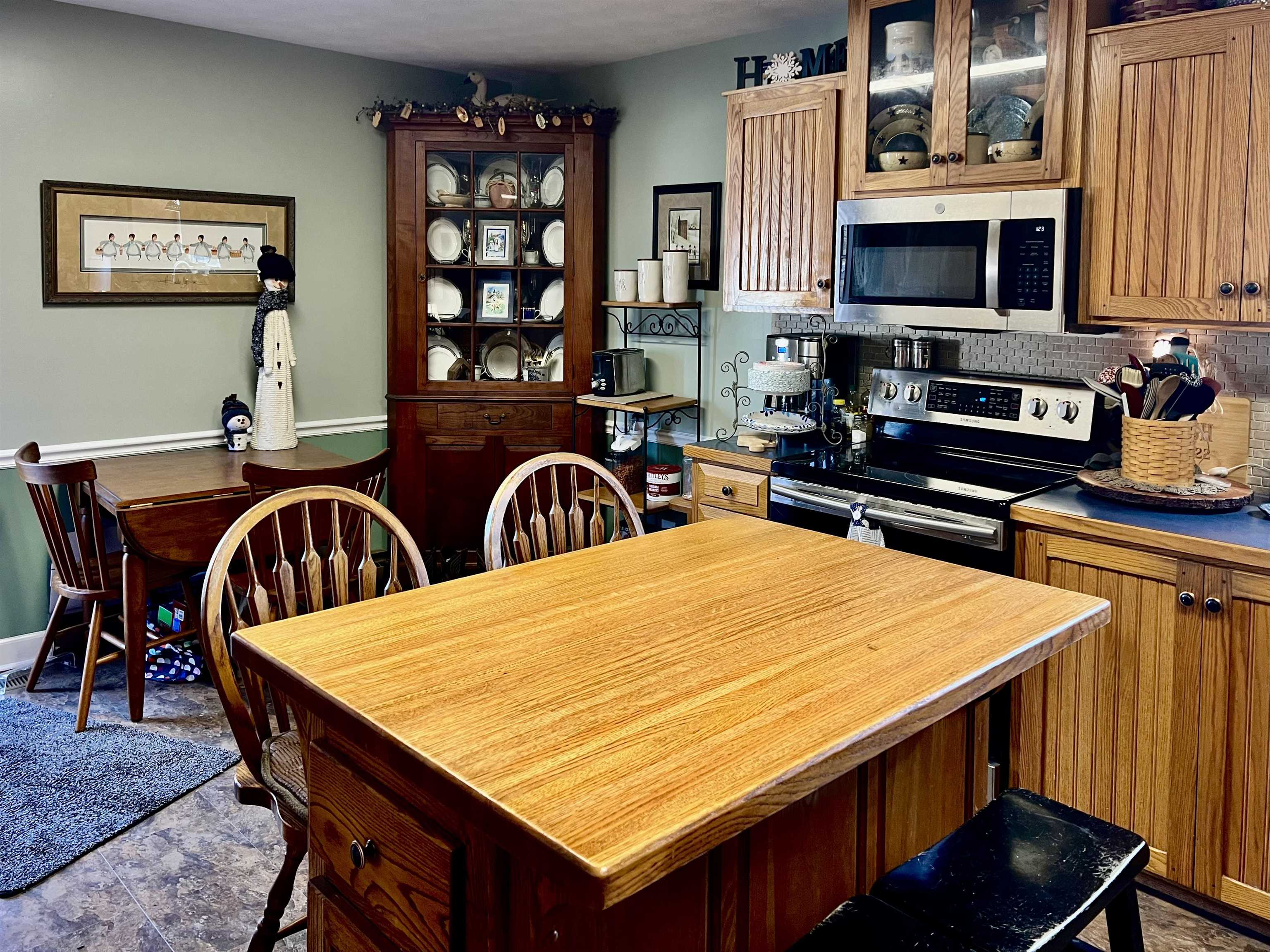 8346 Spring Creek Road Bridgewater, VA 22812 - Photo 11 of 16 a room with stainless steel appliances dining table and chairs