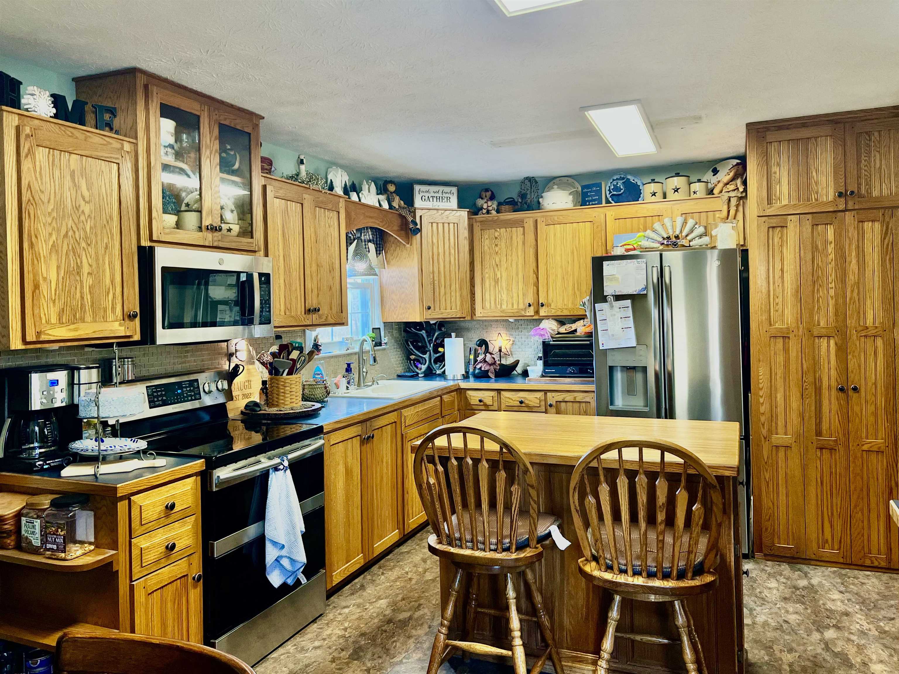 8346 Spring Creek Road Bridgewater, VA 22812 - Photo 12 of 16 a kitchen with stainless steel appliances granite countertop a stove a sink and a refrigerator