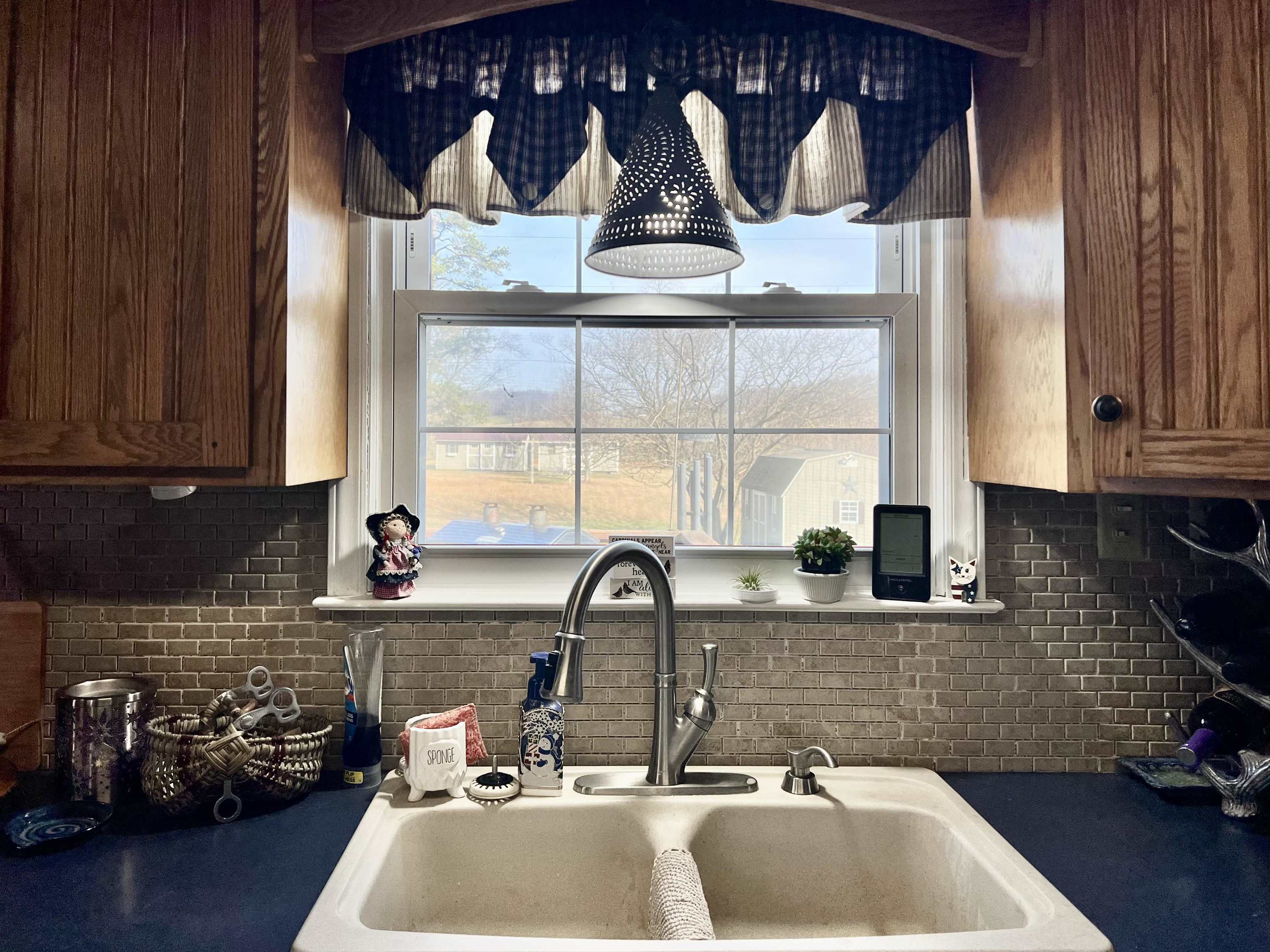 8346 Spring Creek Road Bridgewater, VA 22812 - Photo 13 of 16 a sink with a window and cabinets