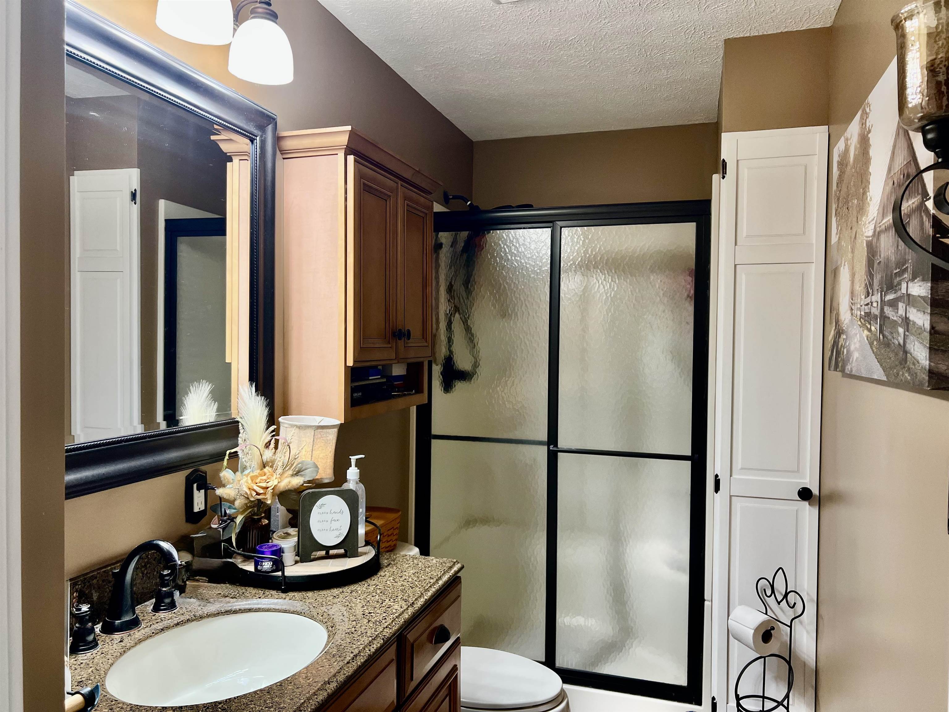 8346 Spring Creek Road Bridgewater, VA 22812 - Photo 15 of 16 a bathroom with a sink toilet and shower