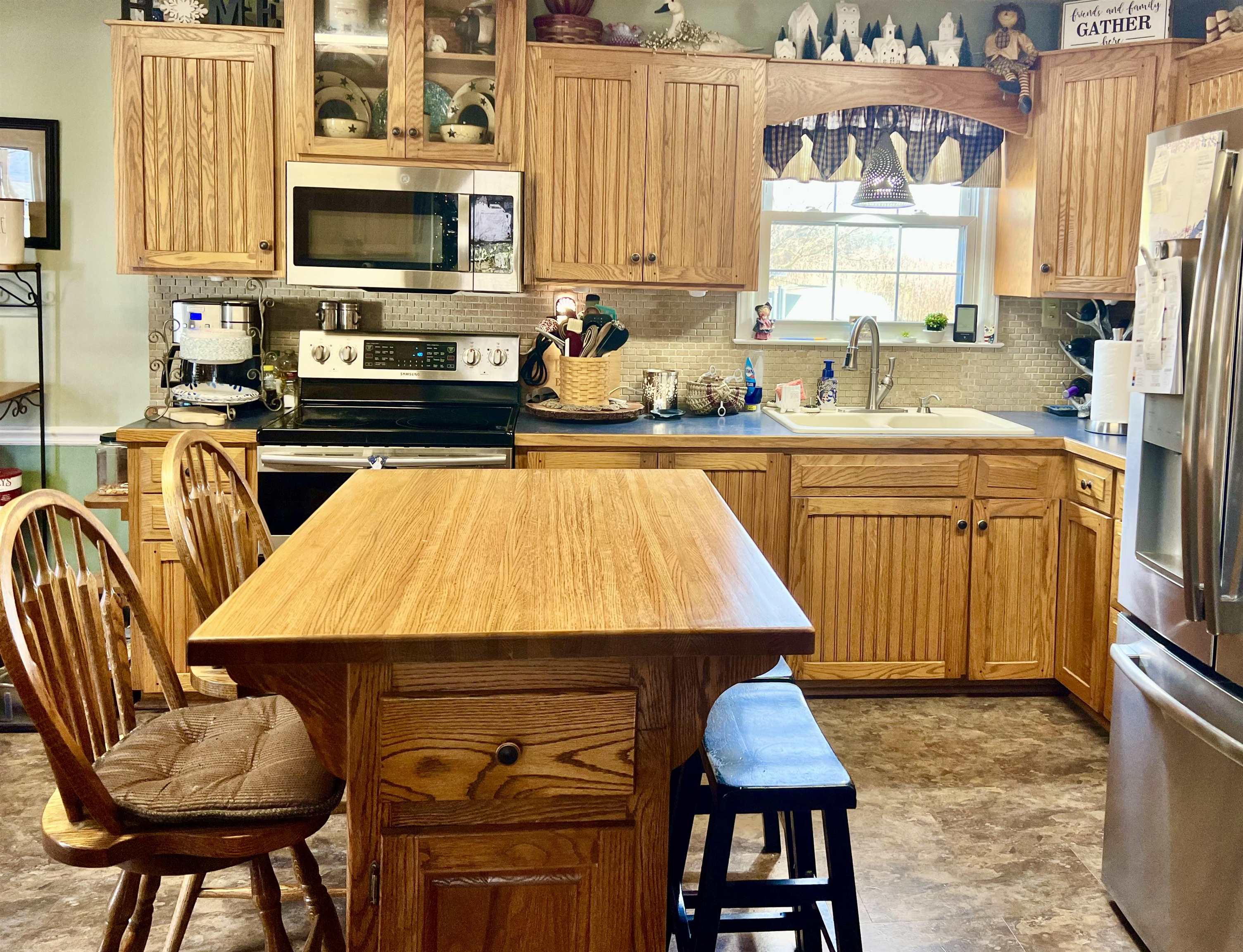 8346 Spring Creek Road Bridgewater, VA 22812 - Photo 10 of 16 a kitchen with a table chairs sink and microwave